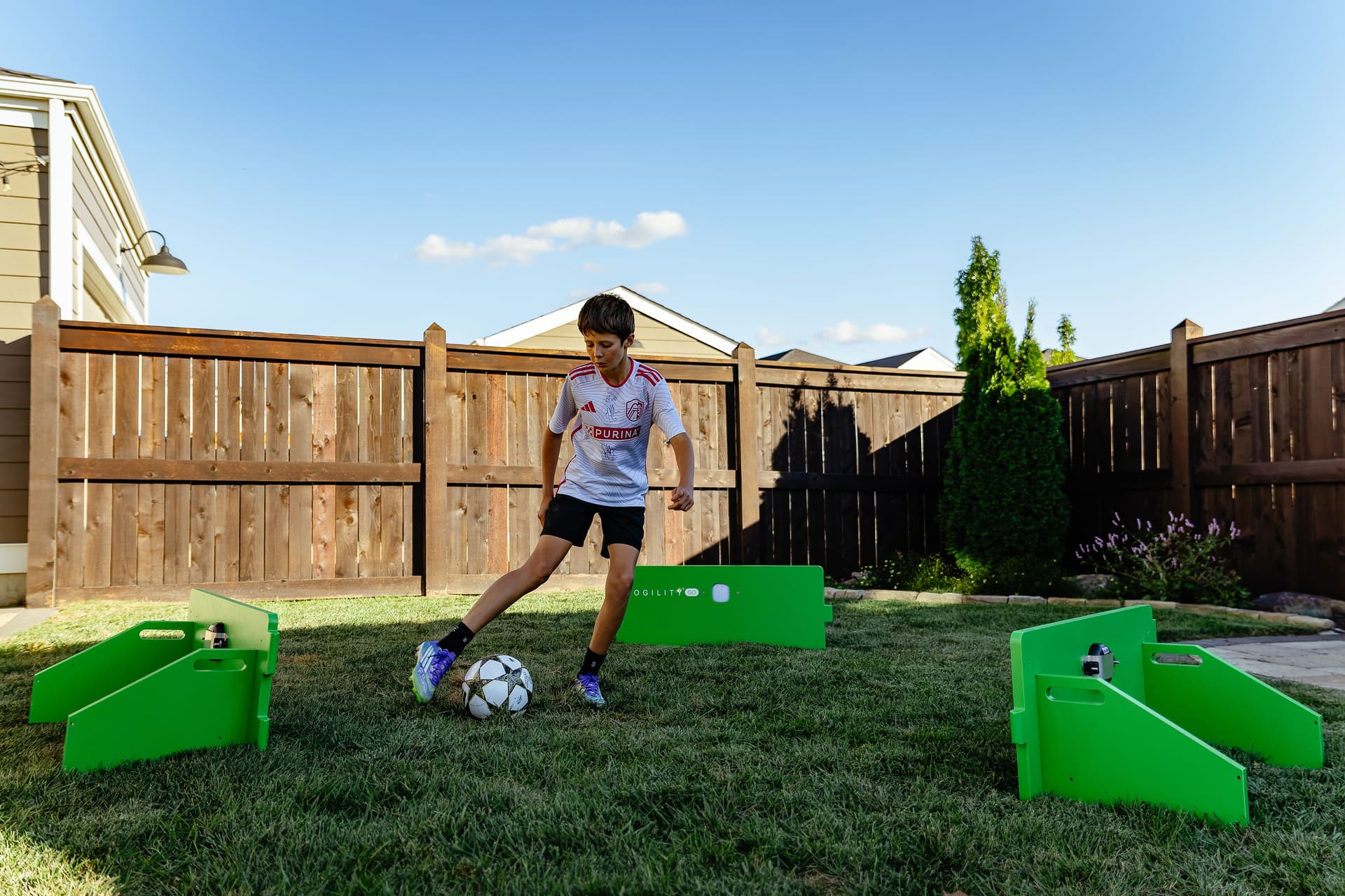 Young player training at home with SogilityGO rebounder boards